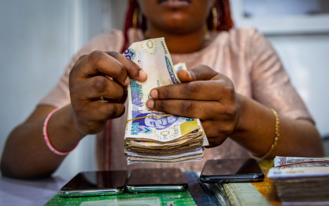 Nigeria devalues naira as part of path to single exchange rate | Business and Economy News | Al Jazeera